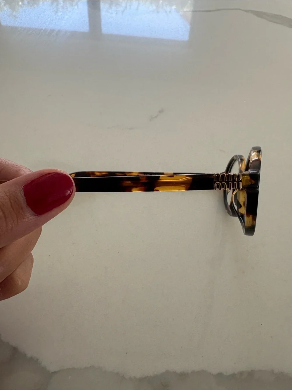 Miu Miu Tortoiseshell Oval Glasses - Brown and Amber